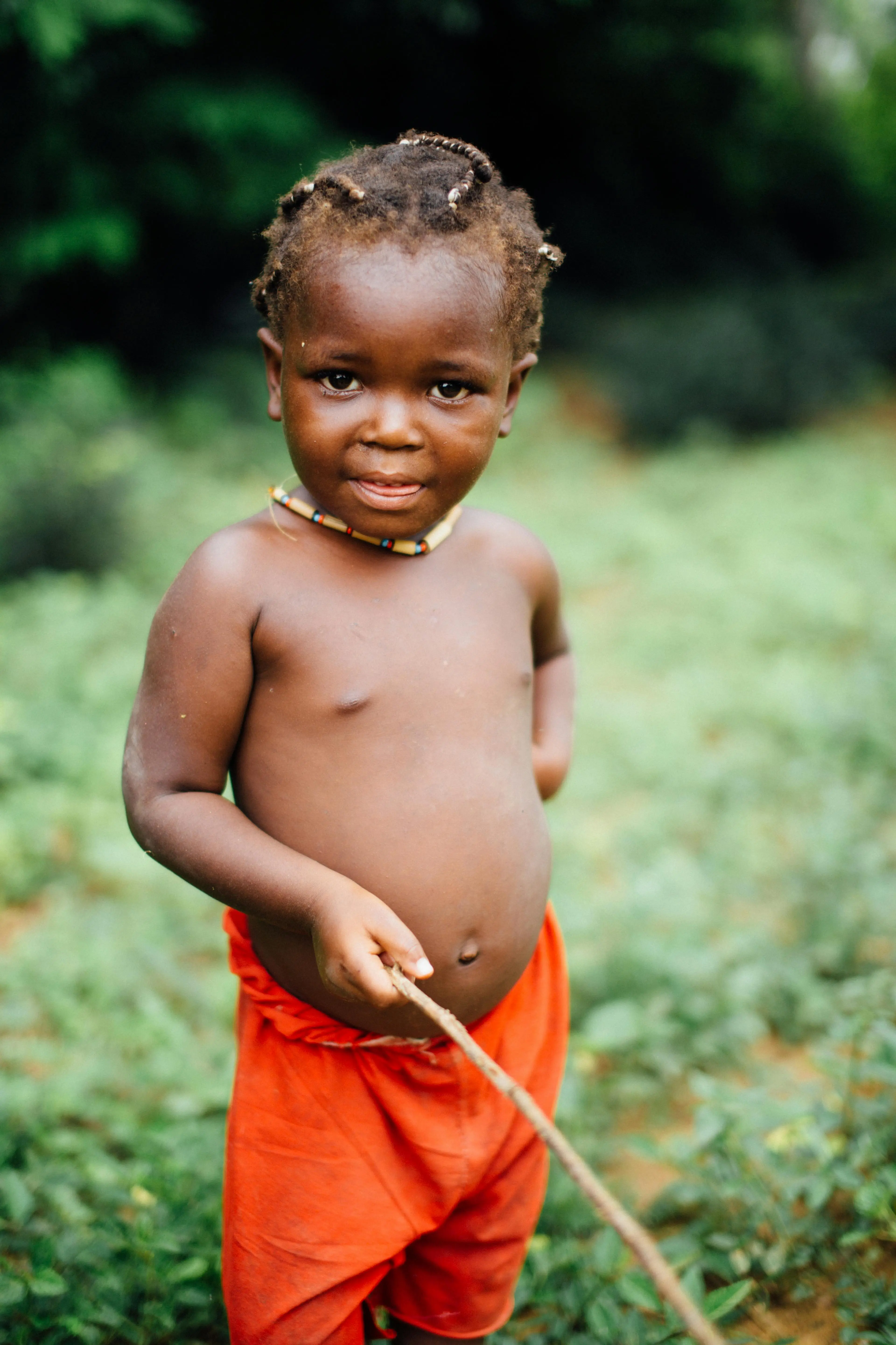 A photo of a boy holding a stick