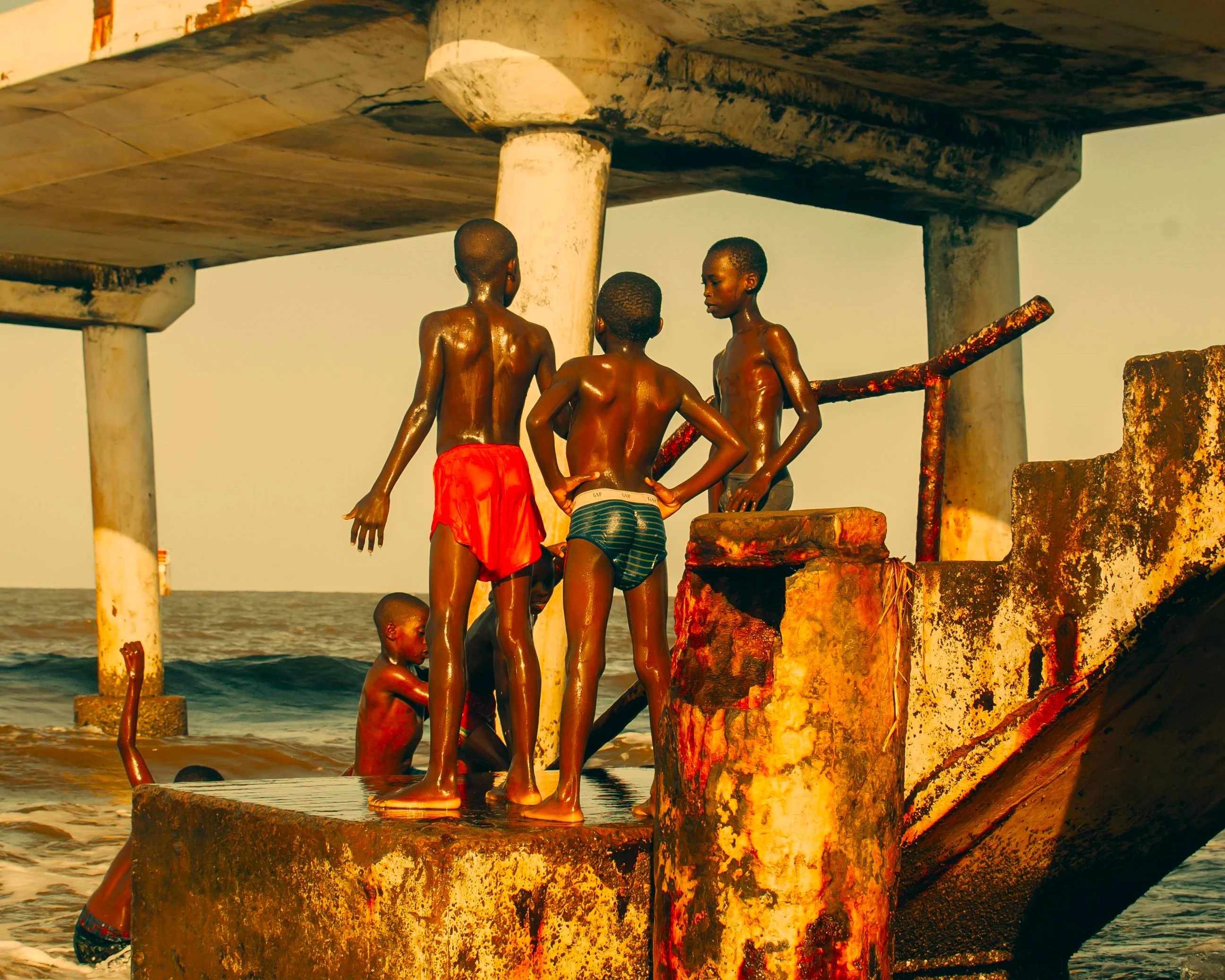 A photo of a group of boys playing at the beach